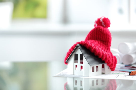 a red hat on a window