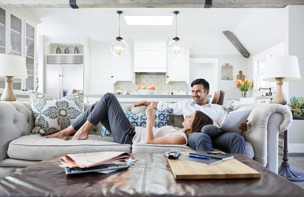 a man and woman lying on a couch