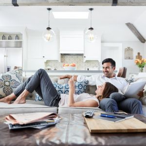 a man and woman lying on a couch
