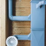 a blue door with a white fan