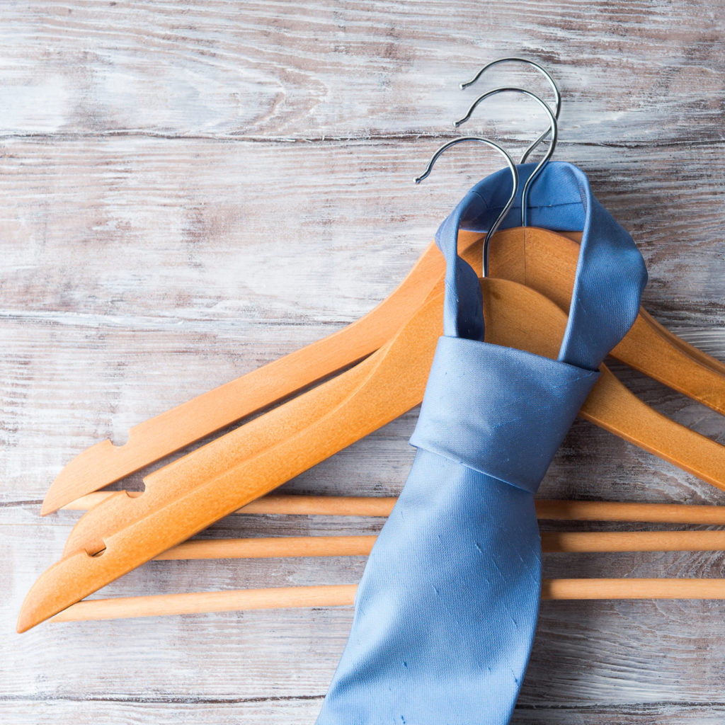 a pair of blue and orange shoes on a wooden surface