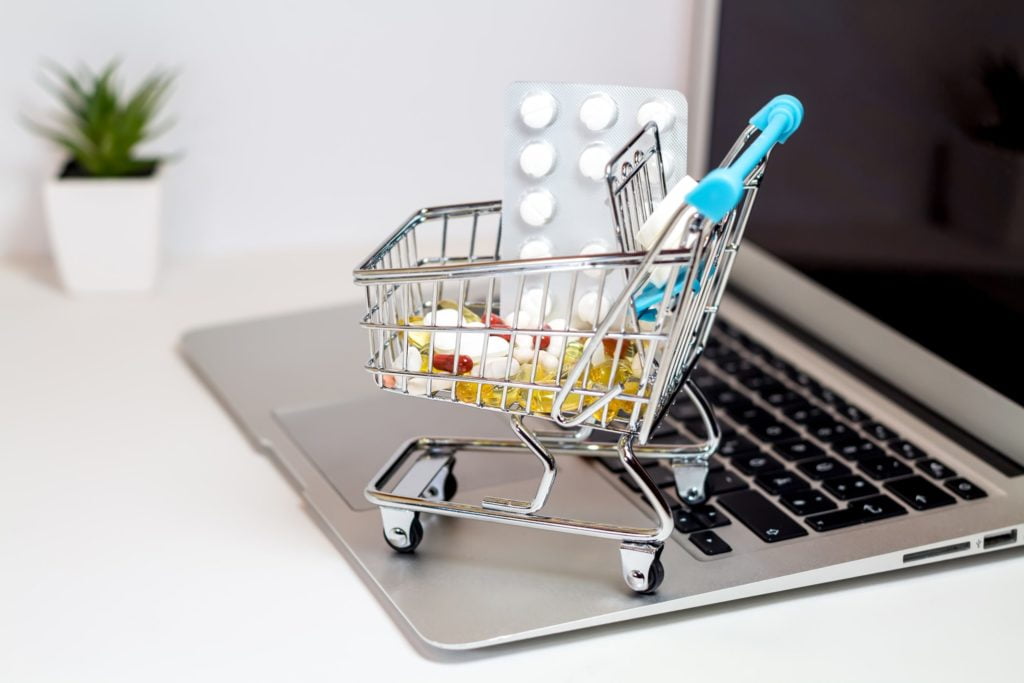 a shopping cart full of pills