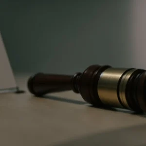 a judge's gavel beside a computer keyboard, symbolizing a legal ruling on cybercrime.